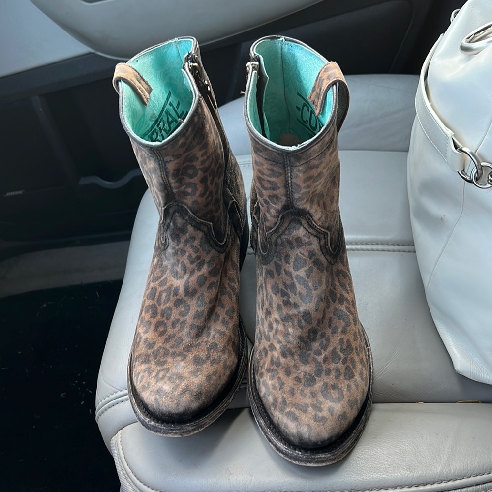 These are a Buckle pair of Cowgirl boots, cheetah print.